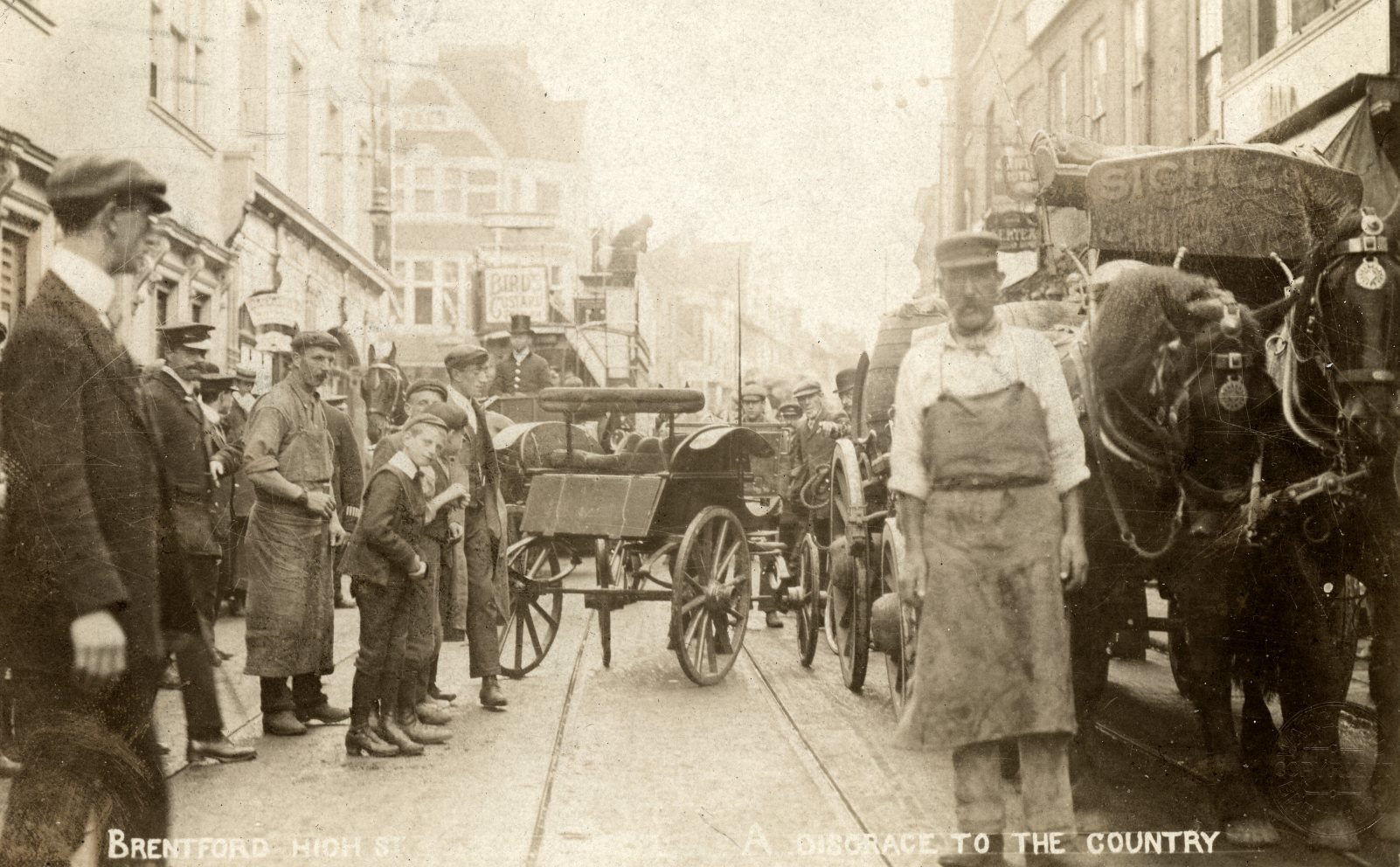 1907 This wakefields postcard calls the high street a disgrace to the country looking east the market place is out of sight on the left between buildings howard webb collection
