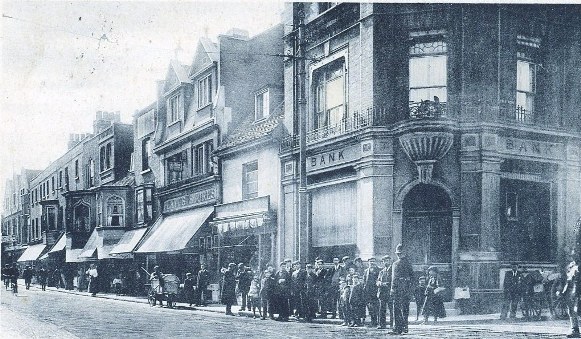 1900s early the bank on high st and half acre corner looking west kind permission of howard webb